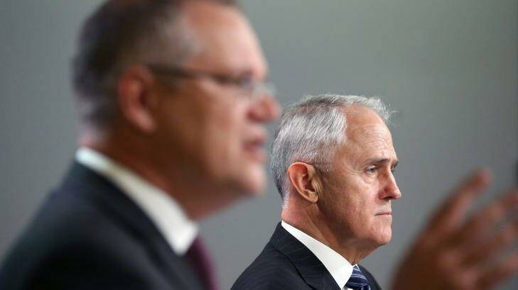 Prime Minister Malcolm Turnbull, right, and Treasurer Scott Morrison comment after the Australian Bureau of Statistics shut down its website to protect census data. Photo: Rick Rycroft