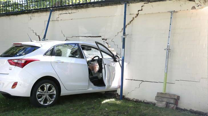 Car lodged in the wall of the Lodge in Canberra after a collision at 8am on Saturday Morning. Photo: Jeffrey Chan