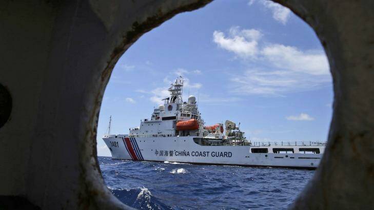 A Chinese Coast Guard ship attempts to block a Philippine government vessel as the latter tries to enter Second Thomas Shoal in the South China Sea in March 2014  to relieve Philippine troops and resupply provisions. Photo: Bullit Marquez