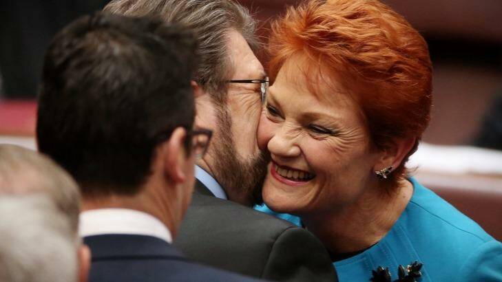 Senator Hanson was also embraced by Senator Derryn Hinch after she delivered her first speech in the Senate. Photo: Andrew Meares