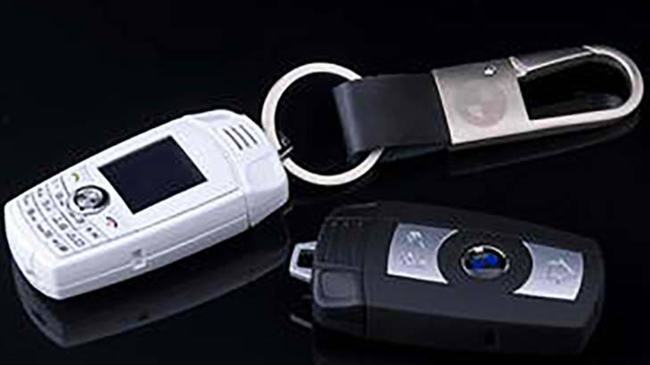 Deceptive: The BMW key-ring phones, sold for as little as $30 in China. Photo: Jo Simpson