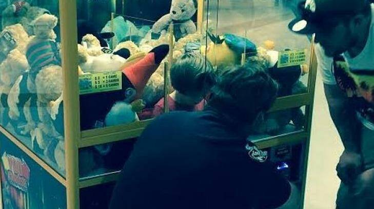 The toddler stuck in the toy machine at a Cairns shopping centre. Photo: Supplied