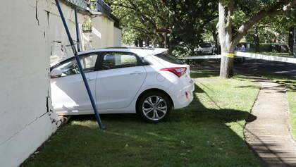Car lodged in the wall of the Lodge in Canberra