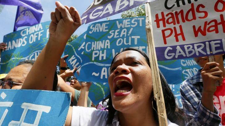 Protesters shout slogans during a rally outside the Chinese consulate in the Philippines hours before The Hague-based UN international arbitration tribunal was to announce its ruling. Photo: Bullit Marquez