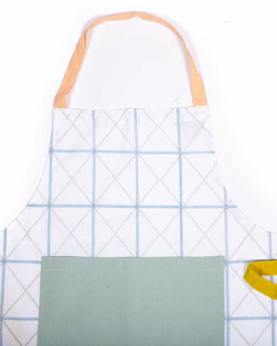 Pinny chic: Mums who cook can stay stylish in the kitchen with this fab-looking apron, from superstar textile designer Beci Orpin. $29.95. arrohome.com Photo: Brook James