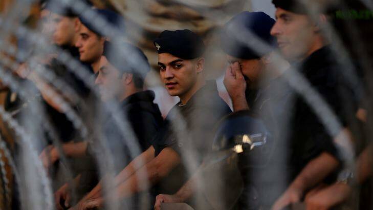 Conflict spreads: Lebanese police guard the area surrounding the Parliament in Beirut. Photo: Kate Geraghty