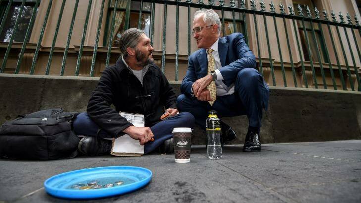 Prime Minister Malcolm Turnbull chats to homeless man Kent Kerswell about the new app Ask Izzy. Photo: Justin McManus