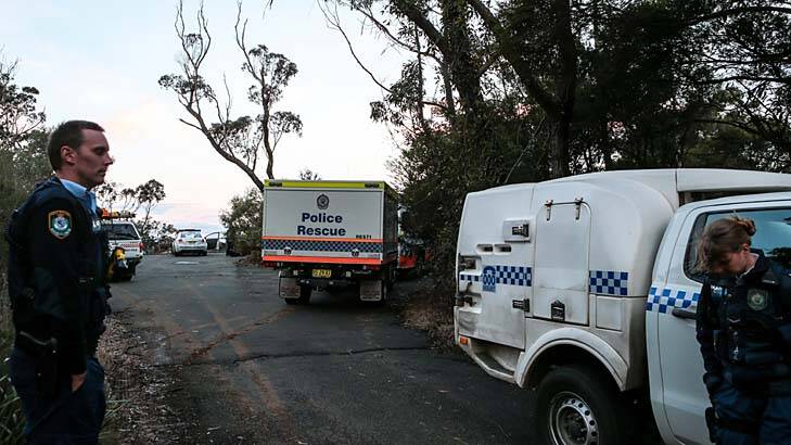 Police, forensic police and the SES at a crime scene. Photo: Adam McLean 