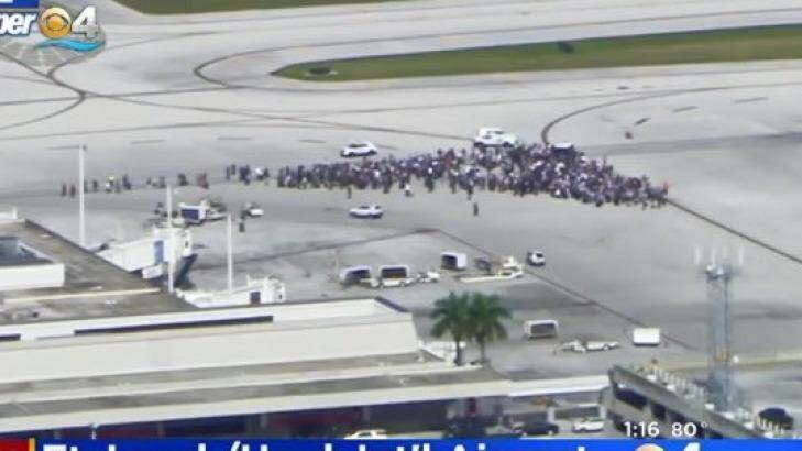 People were evacuated onto the tarmac at Fort Lauderdale Airport following reports of a shooting inside the terminal.  Photo: CBSN