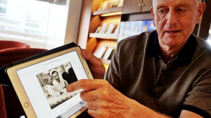 Michael Noyce shows a photo of his aunt at work during the war. Photo: Jefri Tarigan