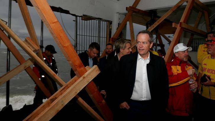 Opposition Leader Bill Shorten tours the storm affected Coogee Surf Life Saving Club in Sydney on Tuesday. Photo: Alex Ellinghausen