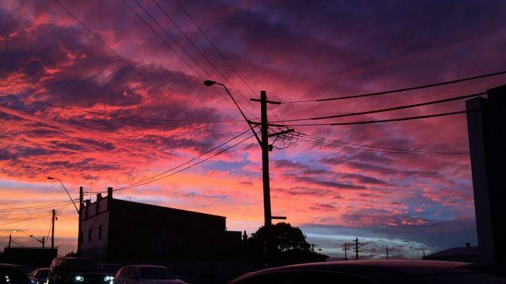 The sunset seen over Parramatta Road, Lewisham. Photo: Steven Siewert