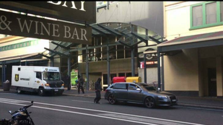 Four men in a Audi grey station wagon were involved in the hold-up of a cash-in-transit van in Glebe in March 2013. Photo: NSW Police