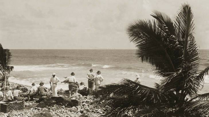 Islanders and members of the Emden watching the battle from the shore of Direction Island. Photo: Australian War Memorial