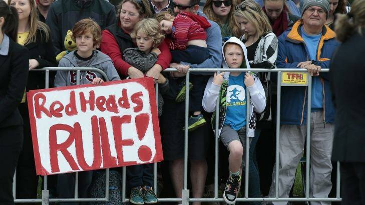 Ethan Toscan, 12, of Bruce with his sign "Redheads Rule" waits to meet Prince Harry at Australian War Memorial. Photo: Jeffrey Chan