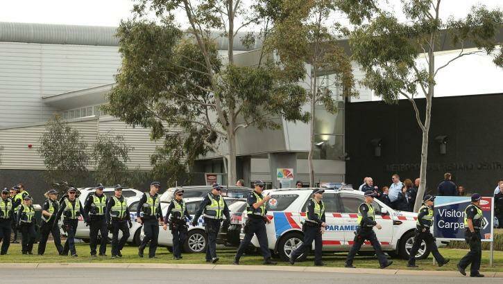 Members of Victoria Police and paramedics at Ravenhall prison where inmates rioted.   Photo: Pat Scala