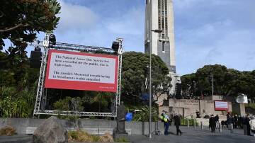 High winds forced the New Zealand's national Anzac Day service to be moved inside. (Ben McKay/AAP PHOTOS)