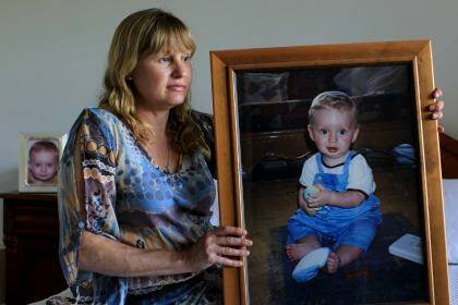Sorely missed: Sue Steele holds a portrait of her son, Scott, who was killed in a car accident in Dee Why. Photo: Janie Barrett