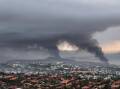 An Australian woman stranded in New Caledonia says the capital Noumea resembles a war zone. (AP PHOTO)