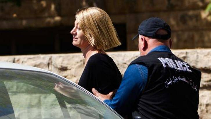 '60 Minutes' reporter Tara Brown is escorted from court  in Beirut on Monday. Photo: Diego Ibarra Sanchez/Getty Images.