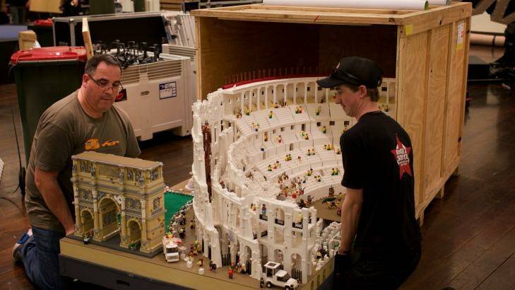 Lego builder Ryan McNaught, left, and a worker set up for the Lego exhibition at the Town Hall in Sydney.
 Photo: Wolter Peeters