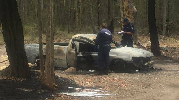People collecting scrap metal discovered a body in a burnt-out ute on Thursday. Photo: Brodie Owen
