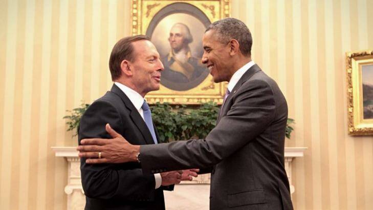 Shaking on it: Abbott and Obama agree to step up defence agreements as the Iraq crisis looms. Photo: Andrew Meares