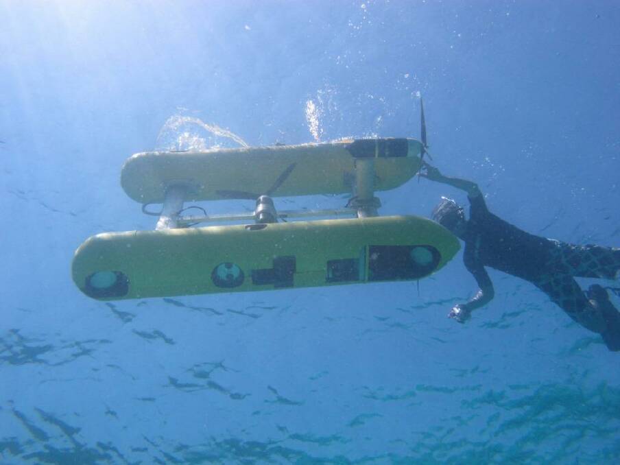 An autonomous underwater vehicle preparing to take high-res images of a coral reef. Photo: Kim Brooks/AIMS