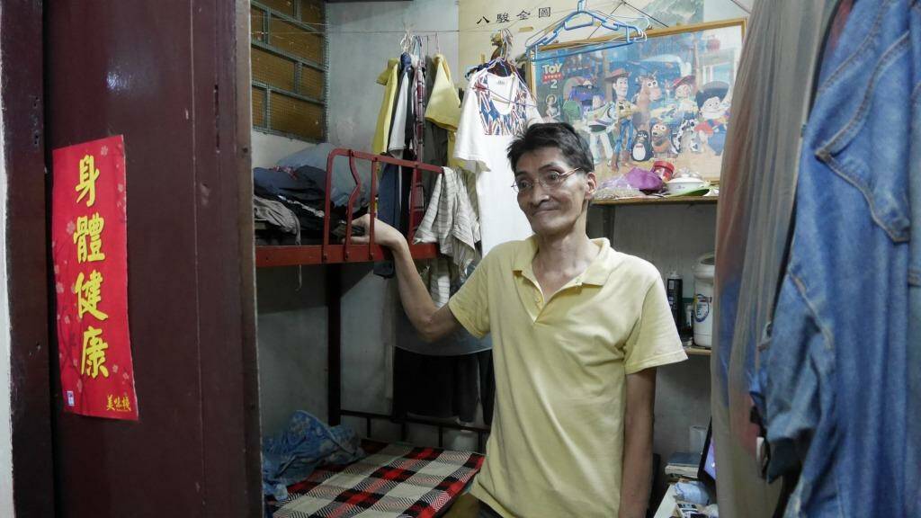 Hard to find work: Lam Ip-sang, in his sub-divided flat. Photo: Philip Wen
