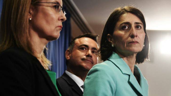 NSW Premier Gladys Berejiklian announcing on Tuesday that the government would proceed with the five merger proposal across Sydney. Photo: Louise Kennerley