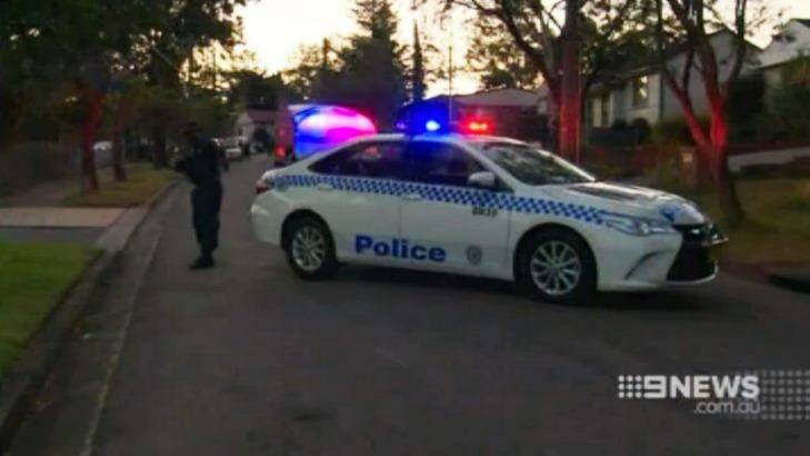 Police block off the street where the pair were stabbed. Photo: Nine News