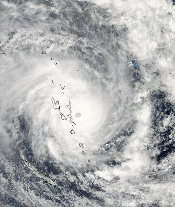 Fewer, more intense cyclones forecast: The eye of Cyclone Pam moving over Vanuatu. Photo: NASA