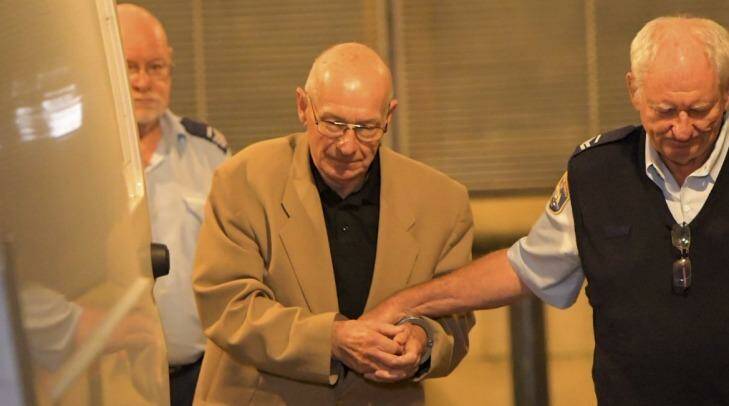 Roger Rogerson is led from the Supreme Court after giving evidence during the Jamie Gao murder trial on Friday. Photo:  Wolter Peeters 