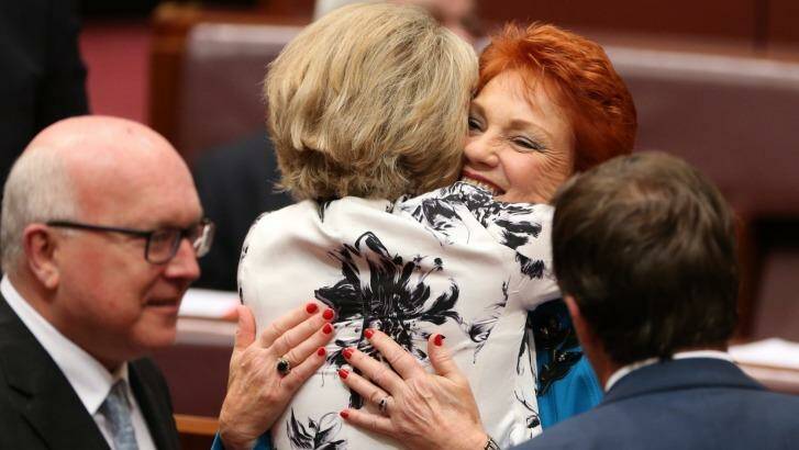 Senator Michaelia Cash hugs Senator Pauline Hanson after her first speech in the Senate on Wednesday. Photo: Andrew Meares