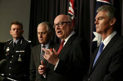 AFP Commissioner Andrew Colvin, Communications Minister Malcolm Turnbull, Attorney-General George Brandis and Director-General of Security Duncan Lewis address the media. Photo: Alex Ellinghausen