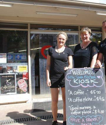 Head chef Megan Jones and owners Kylie Pickett and Kev Chilver with the sign. Photo: Phil McCarroll