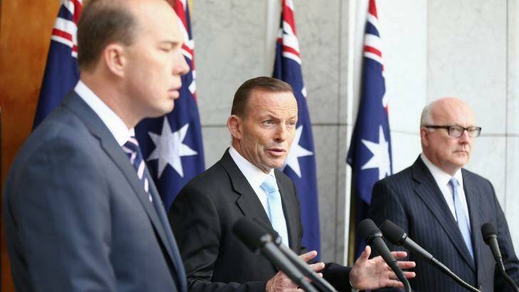 Prime Minister Tony Abbott, pictured with Peter Dutton and George Brandis, stepped up his attack on the ABC on Thursday. Photo: Alex Ellinghausen
