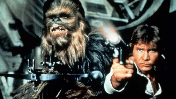 The terrier-like Chewbacca (Peter Mayhew) and Han Solo (Harrison Ford) (right). Photo: Publicity
