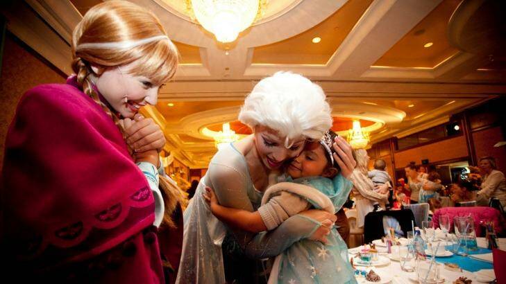 Three-year-old Samara Muir, who was racially vilified at a Disney <i>Frozen</i> event in May, attends a Melbourne high tea to meet the Norwegian sisters she adores, 'Anna' and 'Elsa'. Photo: Arsineh Houspian