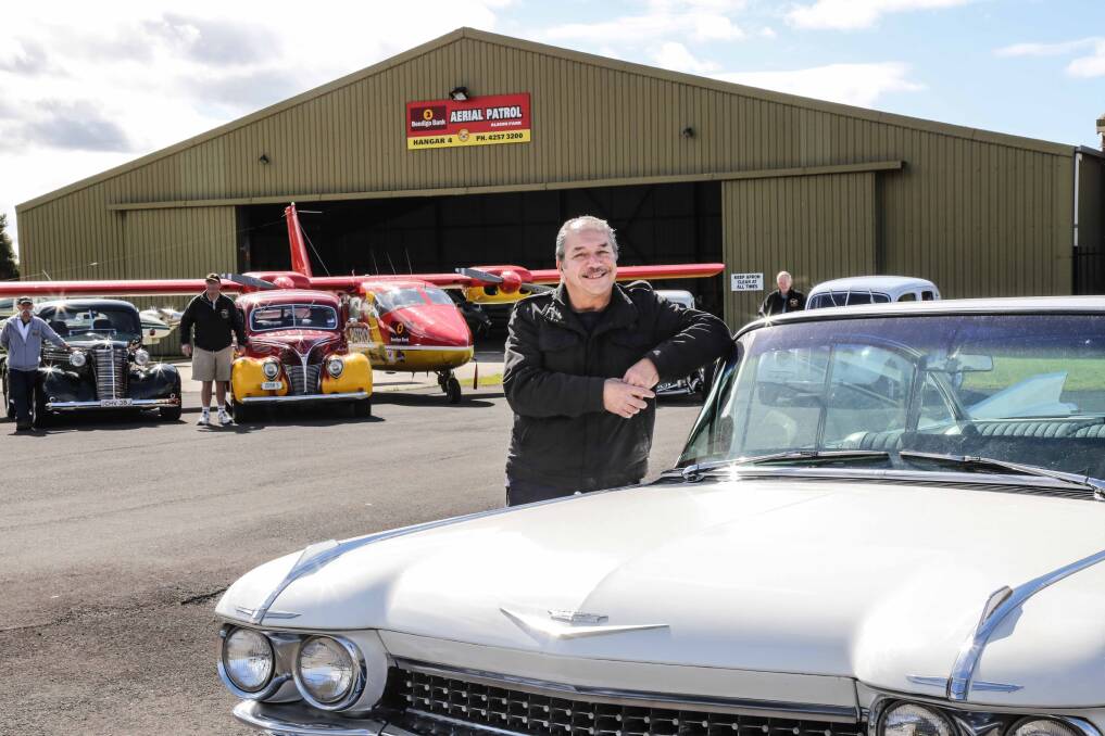 Bendigo Bank Aerial Patrol chairman Harry Mitchell with members of the Romans Hot Rod Club, which will hold a three-day event from Friday, ending with a major show at Kiama on Sunday. Picture: GEORGIA MATTS