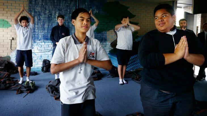Giving peace a chance: Jerald Paul and Sione Ova, front, take part in a meditation class at Balgowlah Boys. Photo: Peter Rae