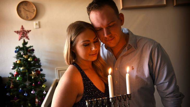 Interfaith couple Lana and Luke Oxnam will celebrate both Christmas and Hanukkah on the same day. Photo: Steven Siewert