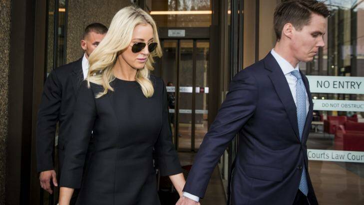 Oliver Curtis and wife Roxy Jacenko leave his sentencing hearing on Friday. Photo: Anna Kucera