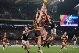 It's always a hard-fought battle when the Crows and the Power go head-to-head in the AFL Showdown. (Matt Turner/AAP PHOTOS)