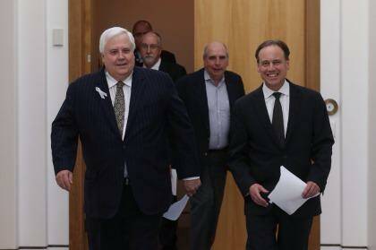 PUP leader Clive Palmer and Environment Minister Greg Hunt, followed by Climate Change Authority boss Bernie Fraser. Photo: Andrew Meares