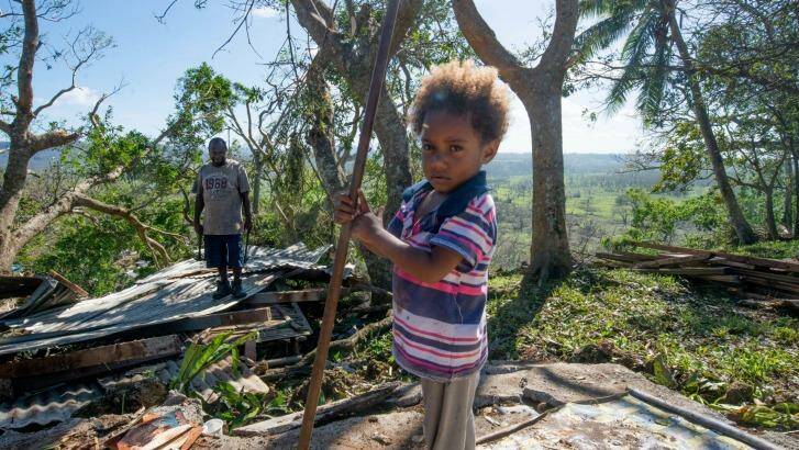 Desolation: Vanuatu residents clean up after Cyclone Pam. Photo:  UNICEF/ Getty Images)