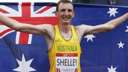Michael Shelley of Australia celebrates after crossing the finish line to win the men's marathon gold medal at the 2014 Commonwealth Games in Glasgow, Scotland, July 27. Photo: RUSSELL CHEYNE