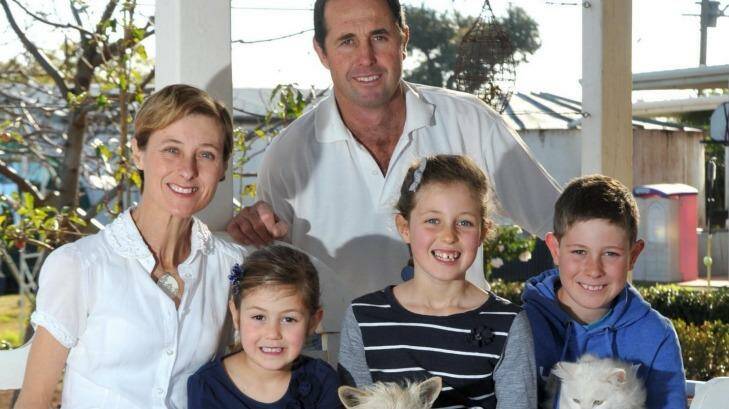 Geoff and Kim Hunt with their children Phoebe (left), Mia and Fletcher. Photo: Les Smith