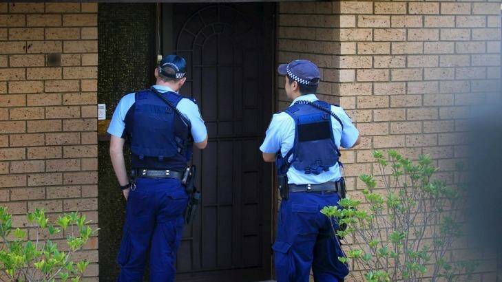 Police visit the Auburn home of the 16-year-old boy on Monday. Photo: James Alcock