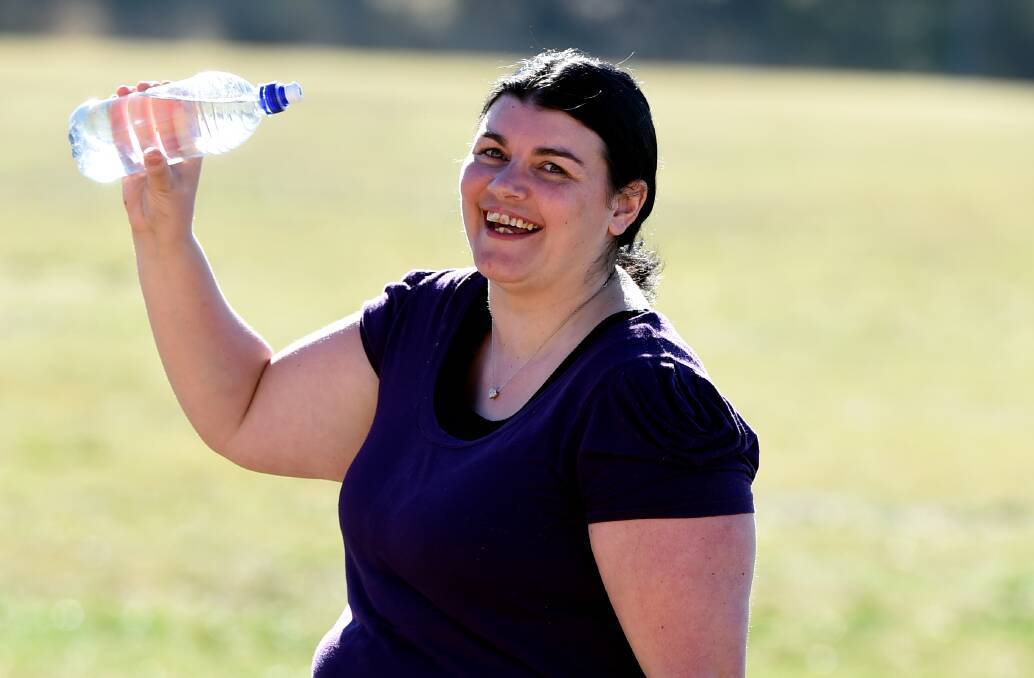 Healthy choice: Robyn Power has taken the H3O challenge of drinking less soft drink and more water and has lost five kilograms. 
PICTURE: LACHLAN BENCE